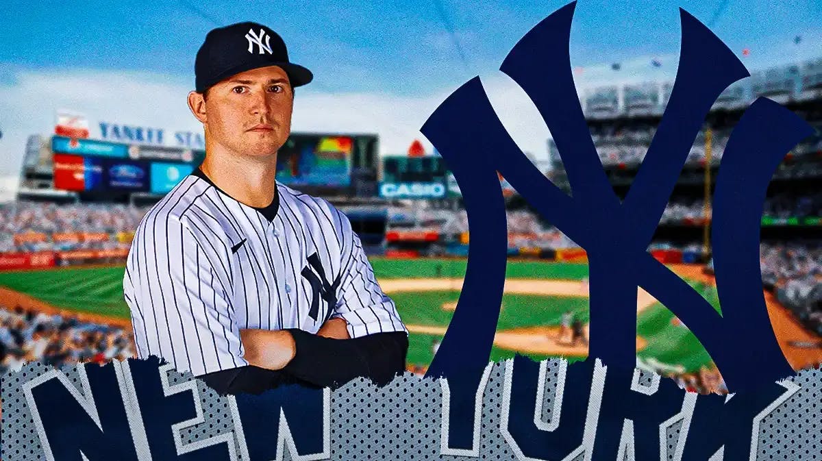 Former All-Star Zack Britton stands next to New York Yankees logo