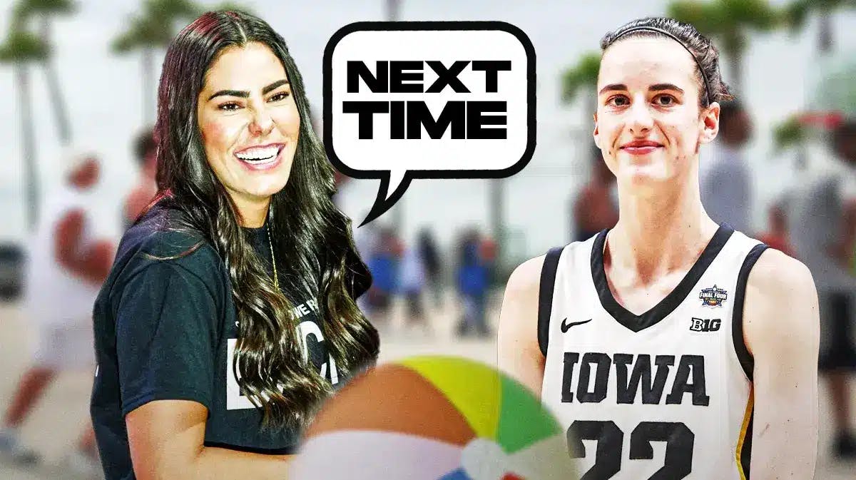 Kelsey Plum in street clothes smiling saying “next time” to Caitlin Clark