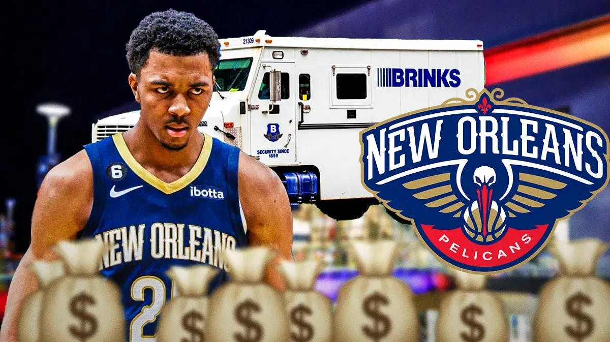 Pelicans Trey Murphy next to moneybags and a Pelicans logo. Brinks trunk in background