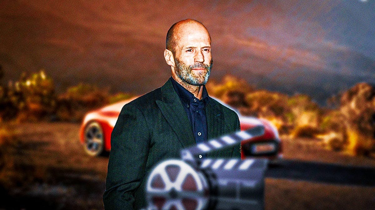 Jason Statham in front of a car from his collection.