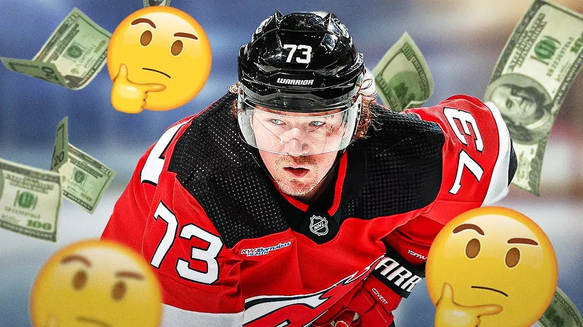 Devils' Tyler Toffoli skating, with thinking emojis beside him and cash falling from the sky