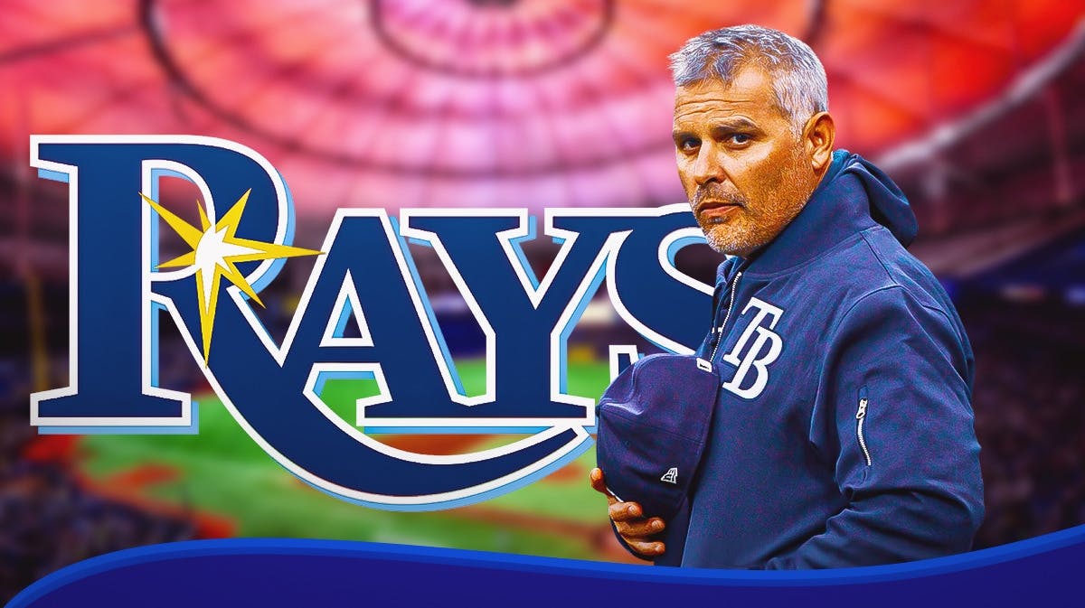 Kevin Cash next to a Rays logo at Tropicana Field