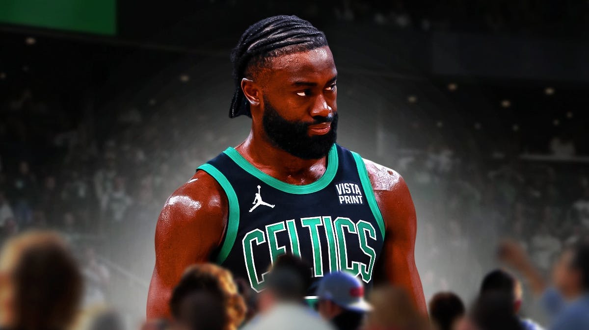 Celtics' Jaylen Brown looking serious/upset on a generic basketball background