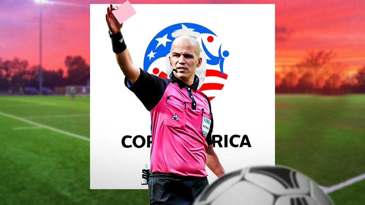 A referee holding up a pink card, the Copa America logo behind him
