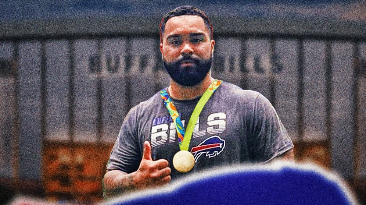 Former WWE superstar Gable Stevenson celebrating with a Bills jersey and an Olympic gold medal medal around his neck