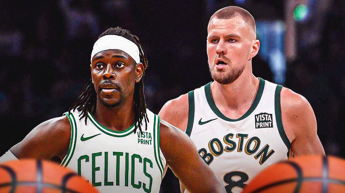 Boston Celtics stars Jrue Holiday and Kristaps Porzingis in front of TD Garden.