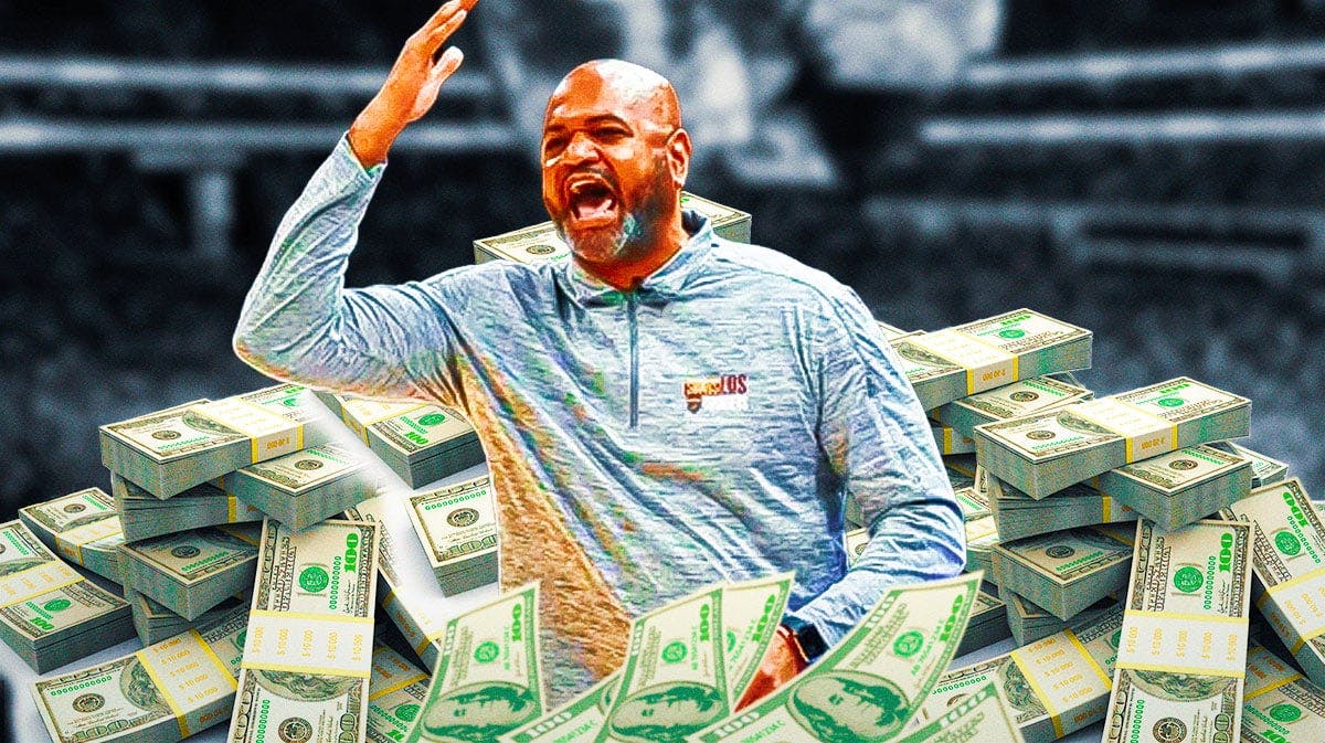 JB Bickerstaff surrounded by piles of cash.