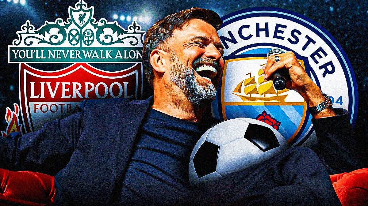 Jurgen Klopp laughing in front of the Liverpool and Manchester City logos
