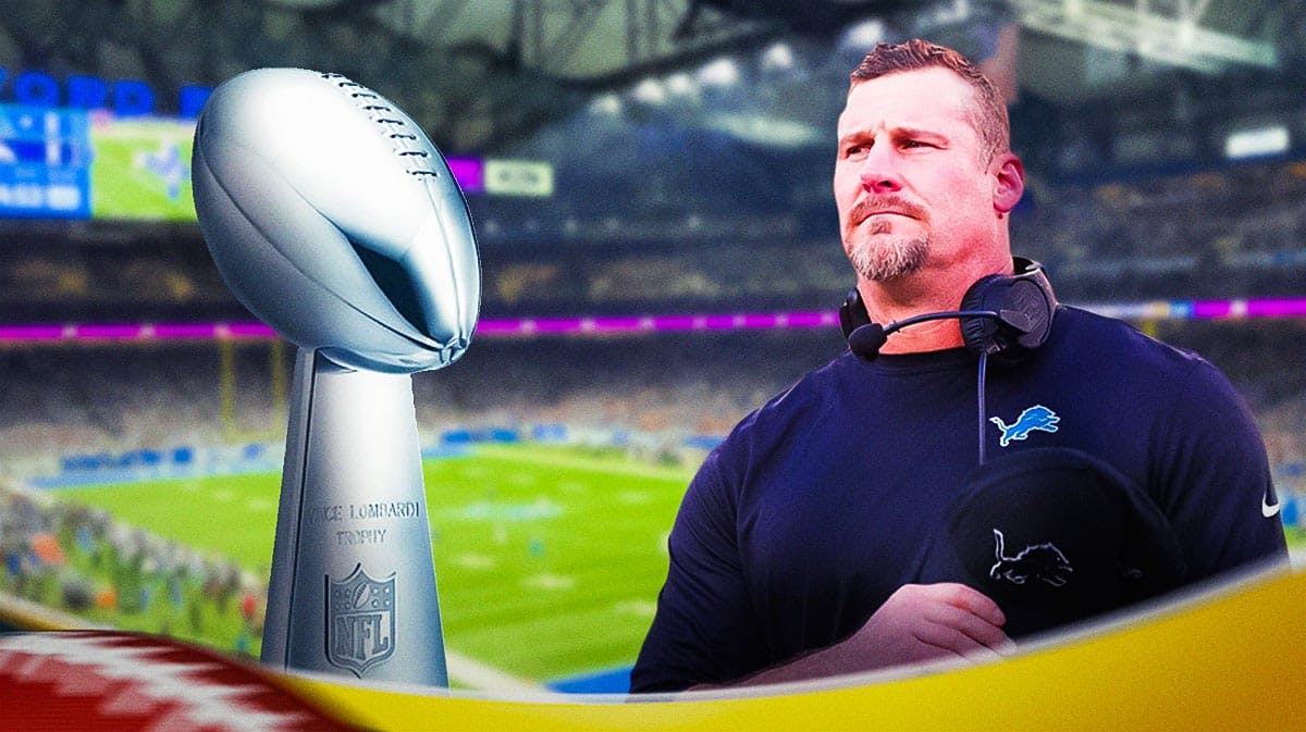 Lions' Dan Campbell next to Lombardi trophy