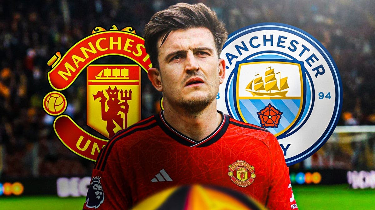 Harry Maguire looking annoyed/down in front of the Manchester United and Manchester City logos