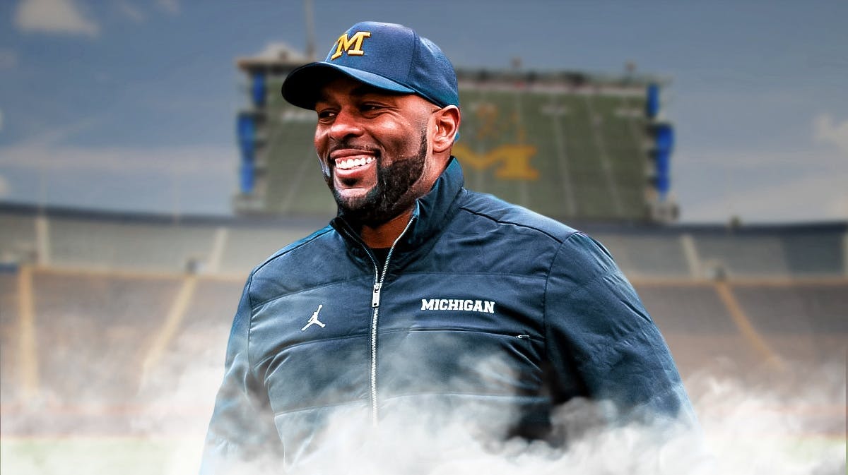 Michigan football, Wolverines, Michigan football NIL, NIL, Valiant, Sherrone Moore looking hyped up with Michigan football stadium in the background