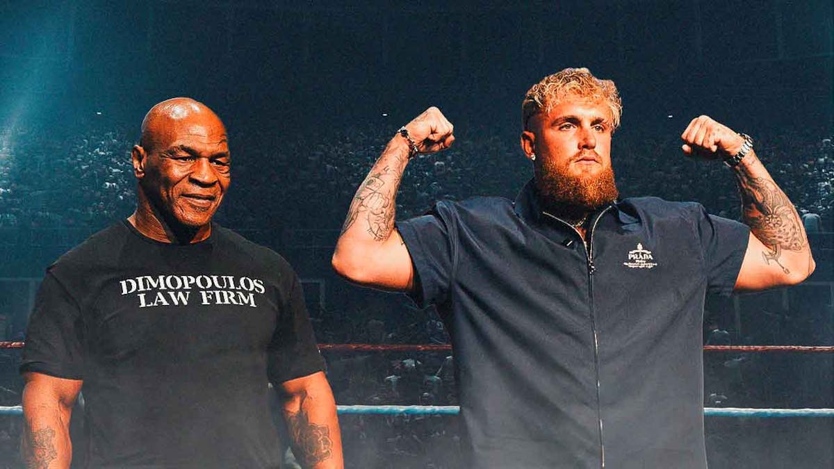 Mike Tyson stands next to jake Paul before boxing bout