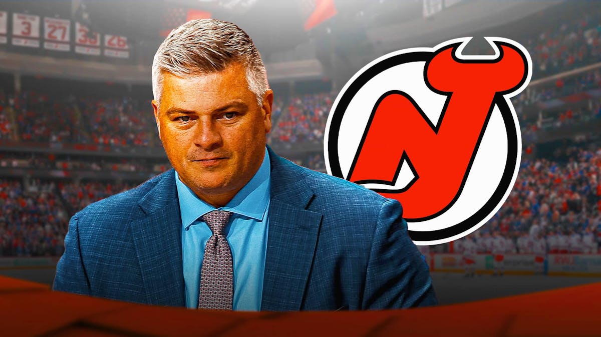 New Devils coach Sheldon Keefe looks at New Jersey crowd, Lindy Ruff in background