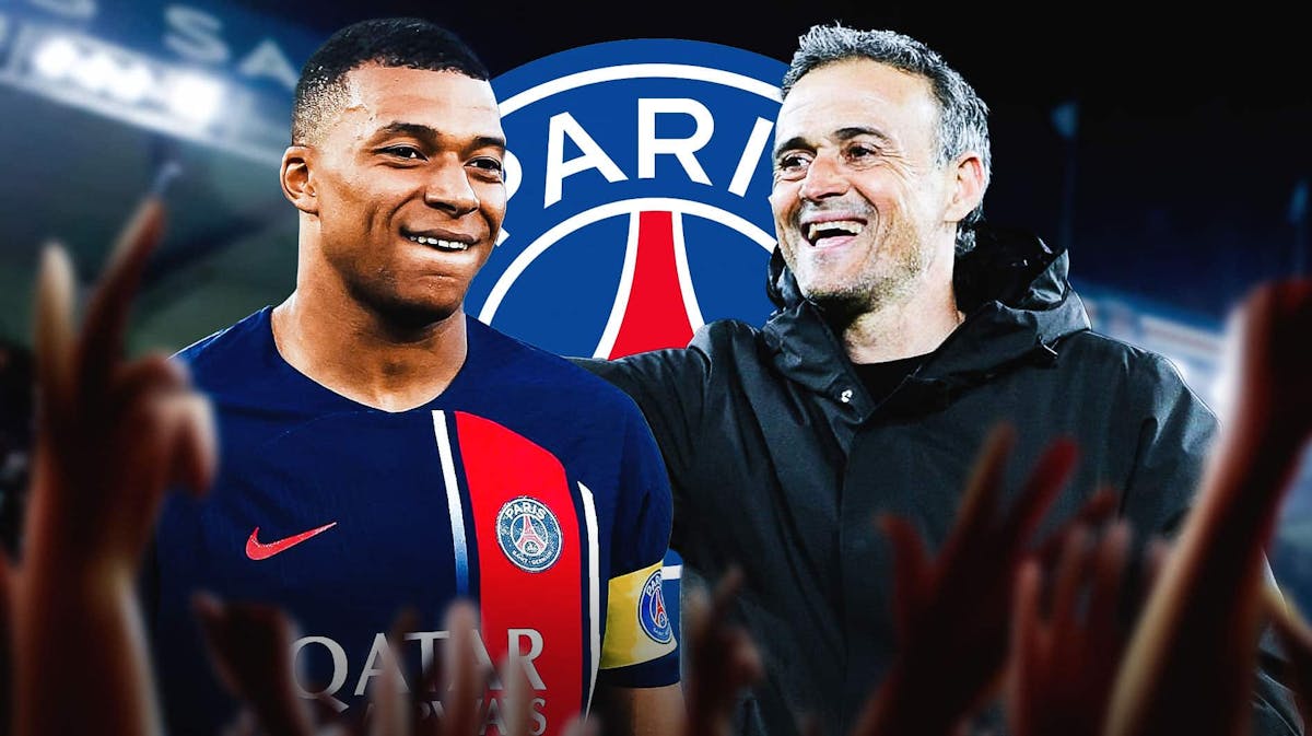 Luis Enrique laughing next to Kylian Mbappe, the PSG logo behind them