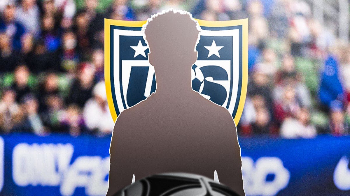 The silhouette of Antonee Robinson in front of the USMNT logo