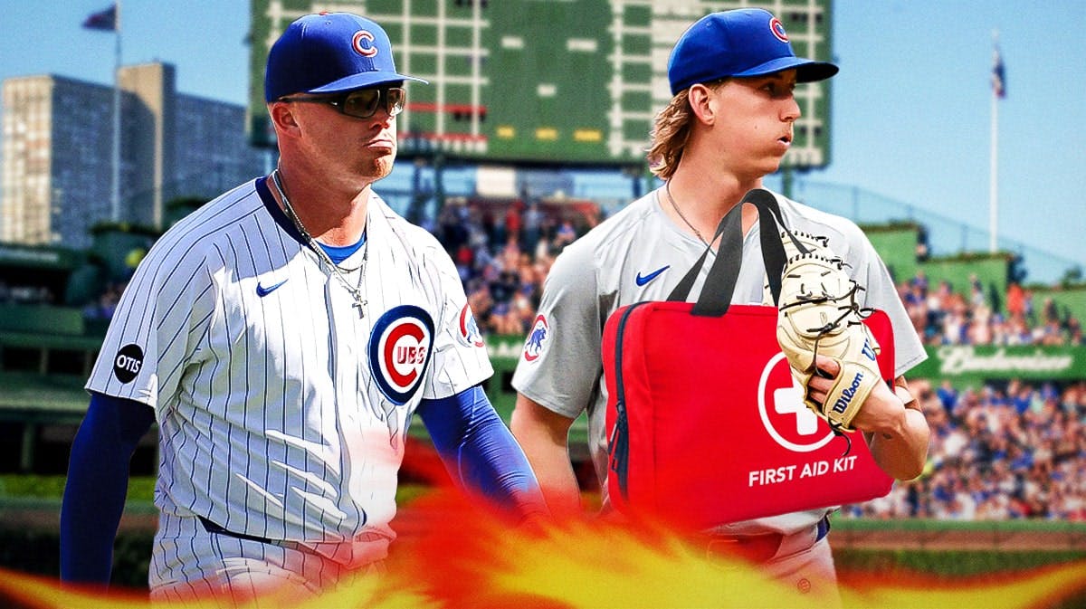 Cubs pitchers Jordan Wicks and Ben Brown with medical kit in front of them, Wrigley Field in back