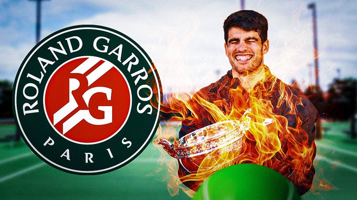 Carlos Acaraz smiles with 2024 French Open trophy after Roland Garros win