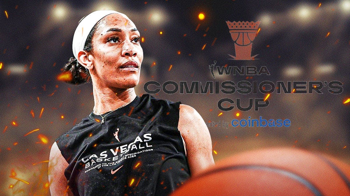 A'ja Wilson yelling flames in back commissioners cup and wings logo in back