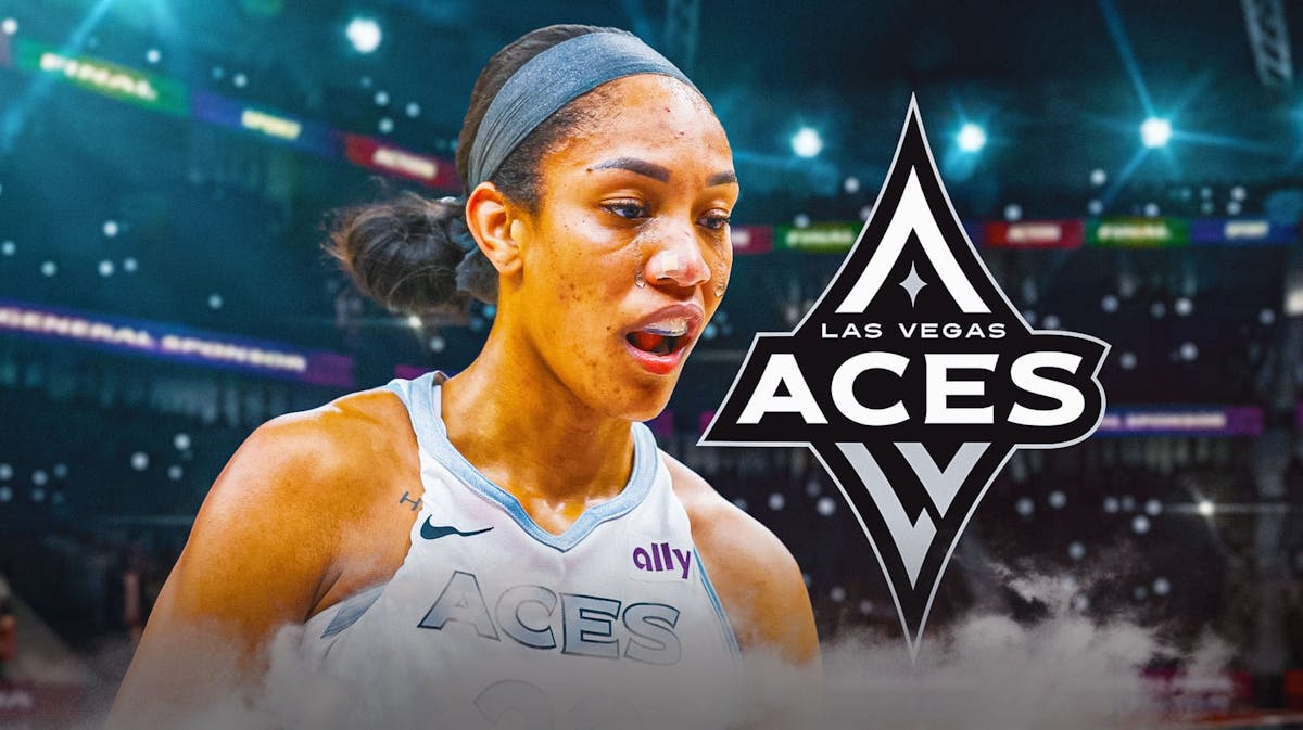 A'ja Wilson looking sad and crying. Las Vegas Aces logo in the background.