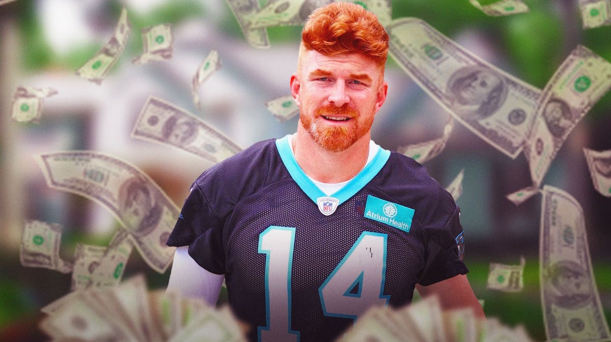 Andy Dalton surrounded by piles of cash.