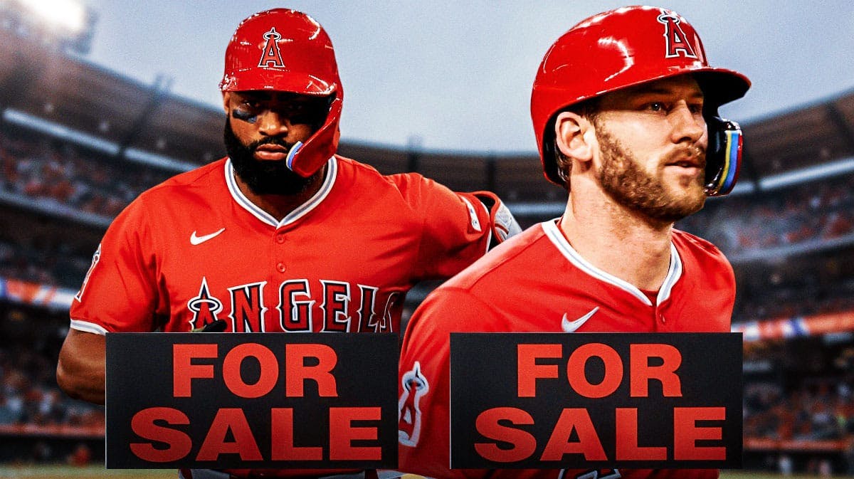 Jo Adell and Taylor Ward with for sale sign. Angels stadium in background