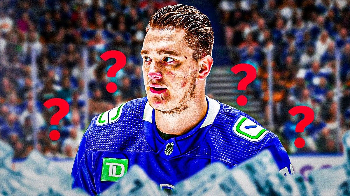 Nikita Zadorov in middle of image looking ster, Vancouver Canucks logo, 3-5 question marks, hockey rink in background