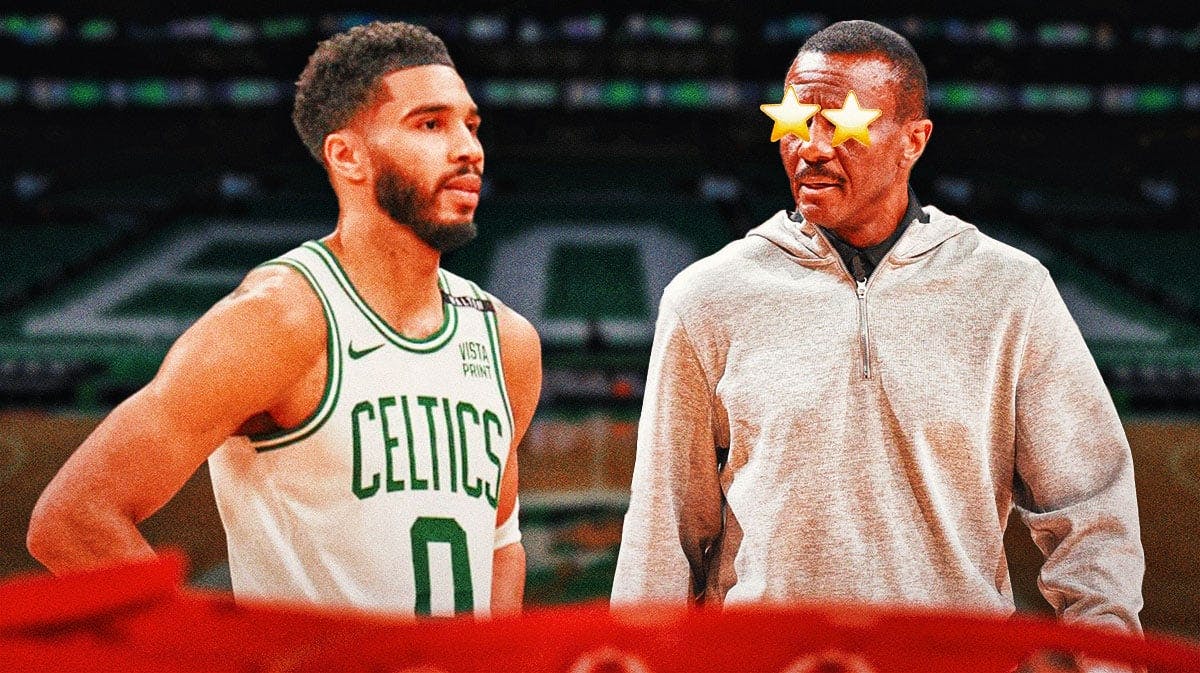 Jayson Tatum on one side, Dwane Casey on the other side with stars in his eyes
