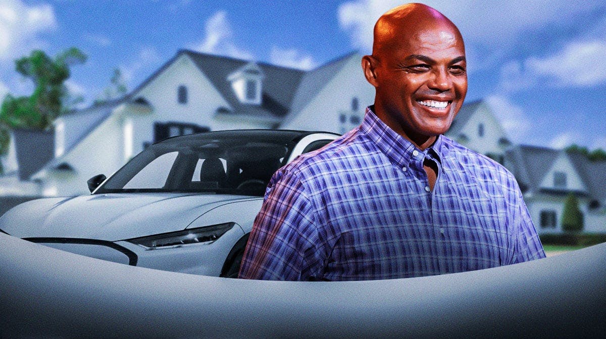Charles Barkley in front of a car from his collection.