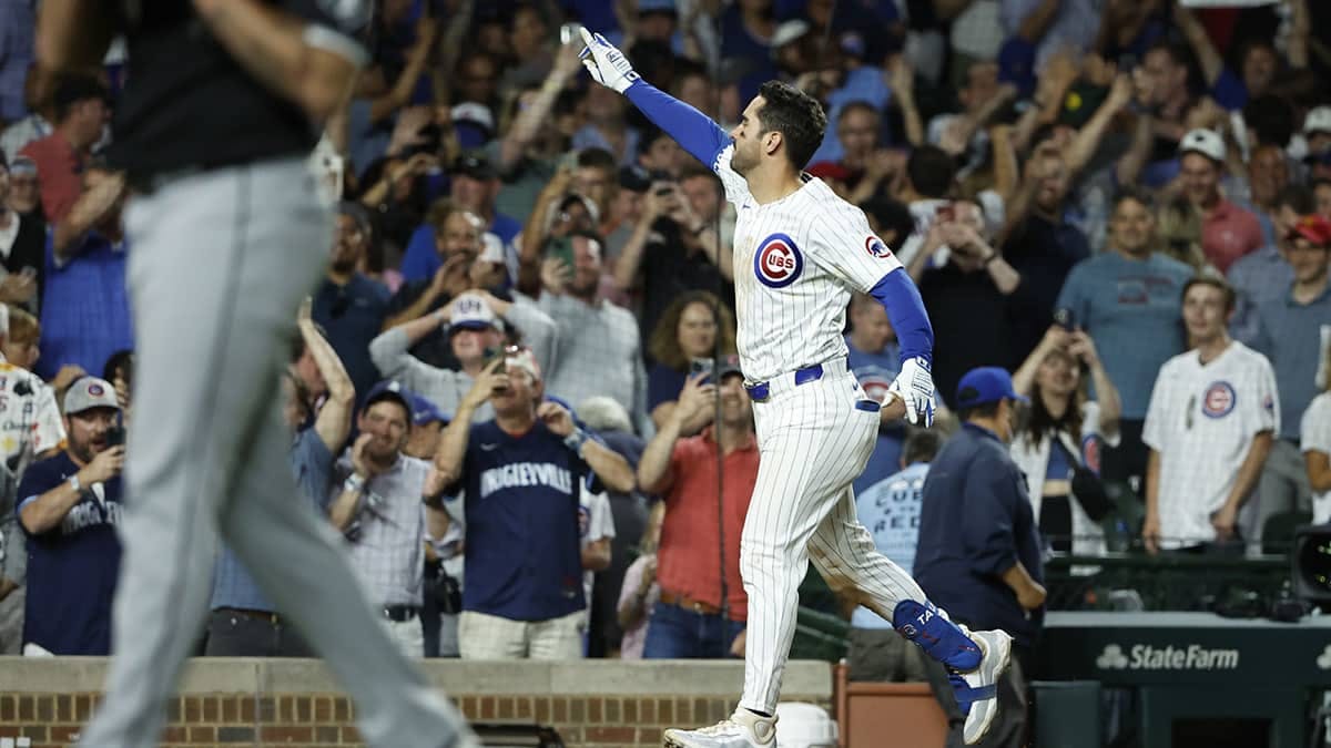 Jun 5, 2024; Chicago, Illinois, USA; Chicago Cubs outfielder Mike Tauchman (40) rounds the bases after hitting a walk-off home run against the Chicago White Sox during the ninth inning at Wrigley Field. Mandatory Credit: Kamil Krzaczynski-USA TODAY Sports