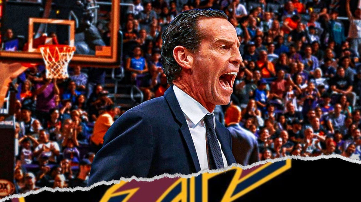 Kenny Atkinson looking happy, Cleveland Cavaliers logo, basketball court in background