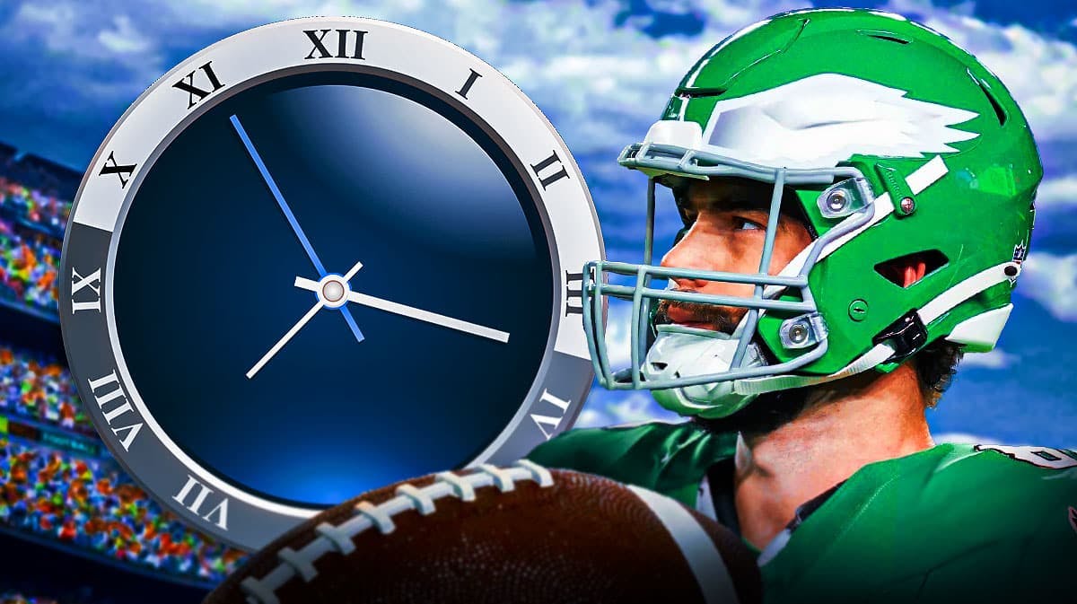 Eagles' Dallas Goedert looking at a clock