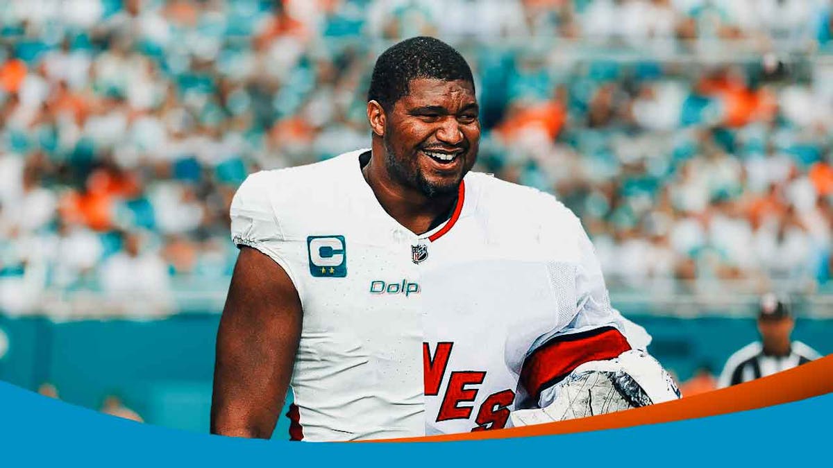 Calais Campbell wearing half of a Miami Dolphins uniform and half of a Miami Hurricanes uniform. Dolphins logo in the background.