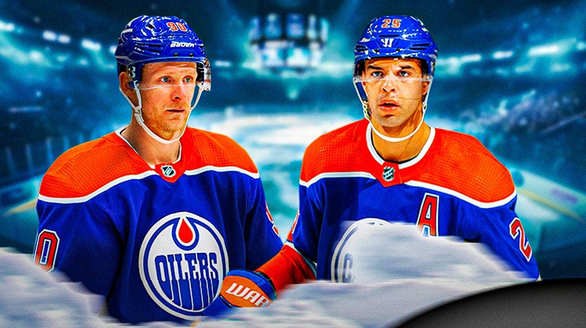 Oilers players Darnell Nurse and Corey Perry looking.