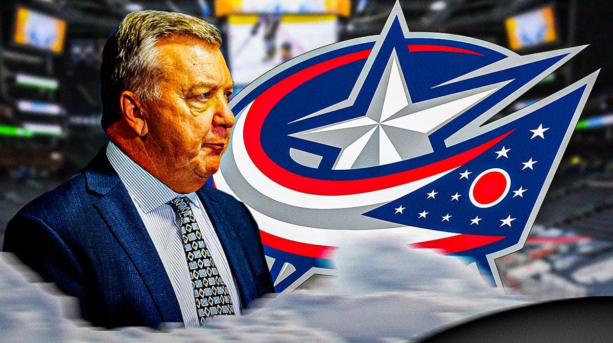 Blue Jackets GM Don Waddell looking at the logo.