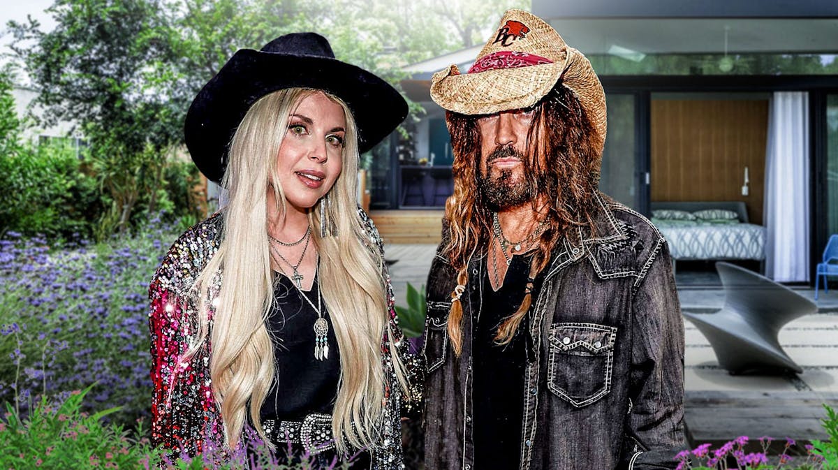 Firerose and Billy Ray Cyrus with a house behind them
