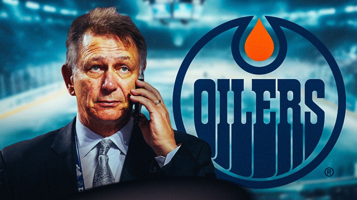 Ken Holland in middle of image looking stern, Edmonton Oilers logo, hockey rink in background