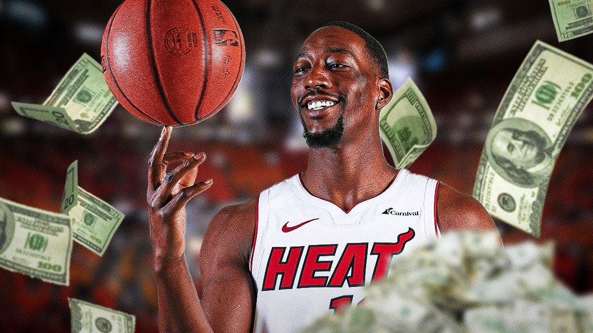 Miami Heat star Bam Adebayo with money around him in front of Kaseya Center.