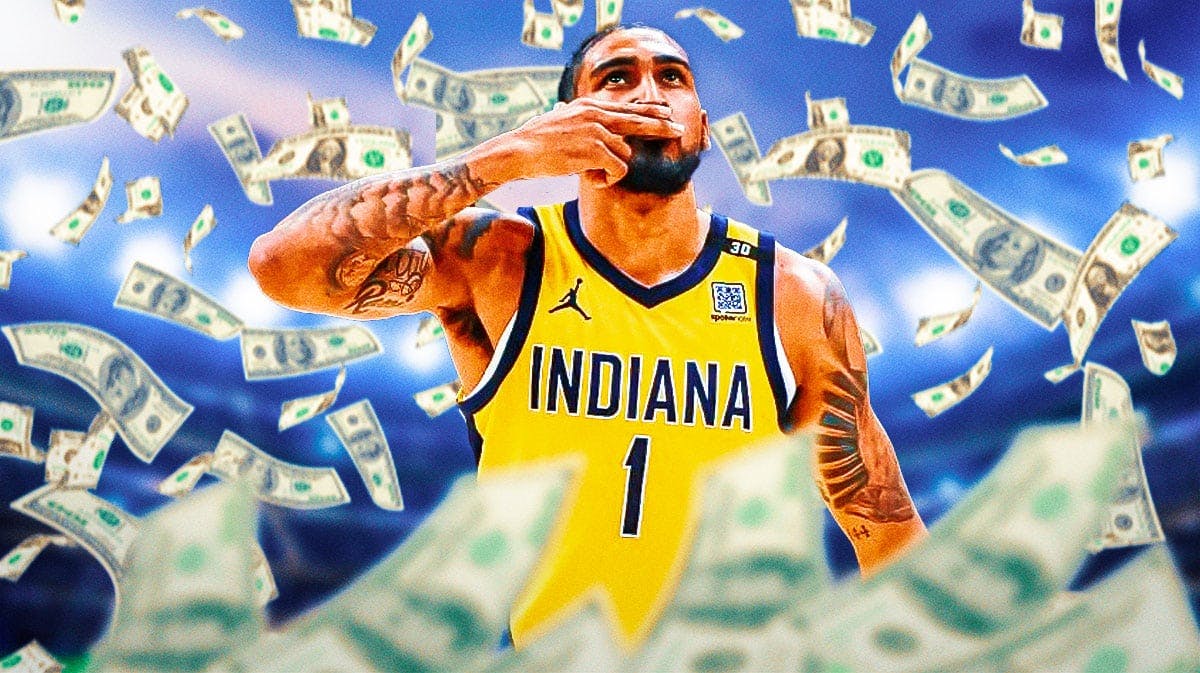 Pacers Obi Toppin with a bunch of money falling around him after his contract extension
