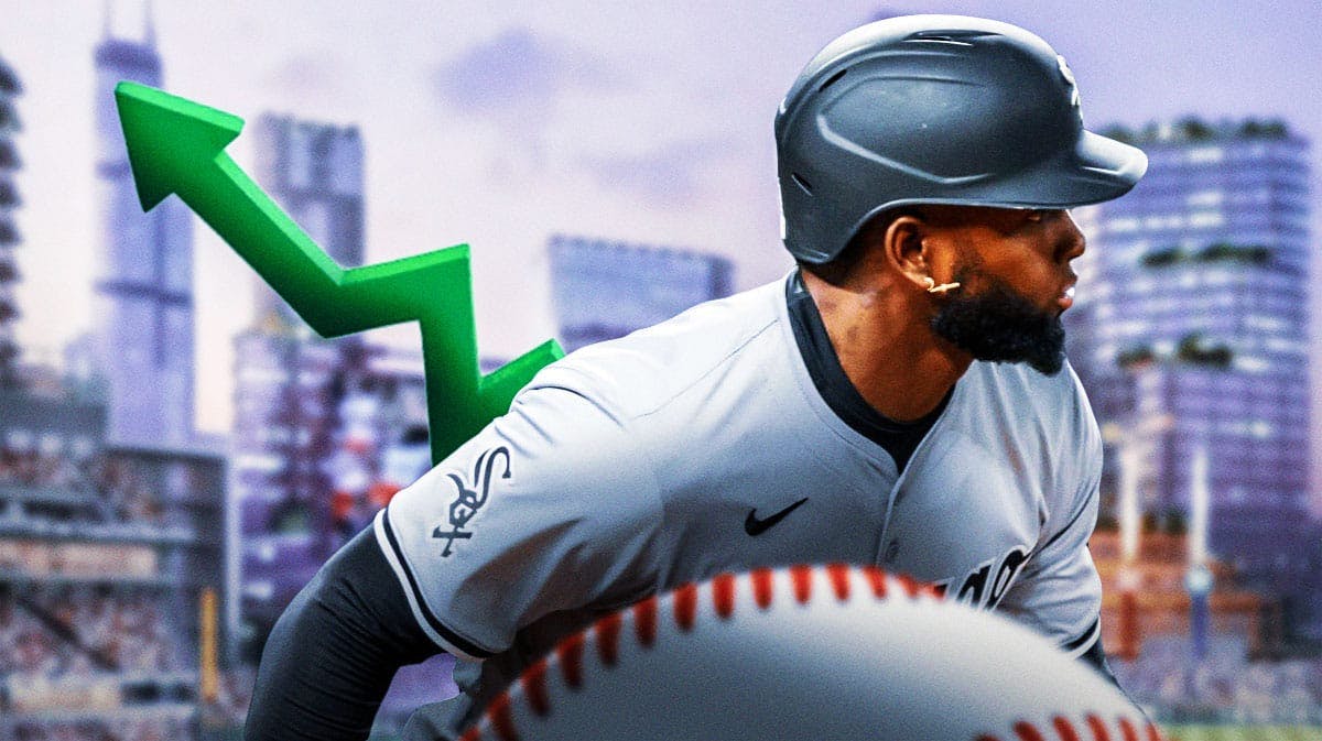 Luis Robert Jr. with green arrow pointing upward. White Sox stadium in background