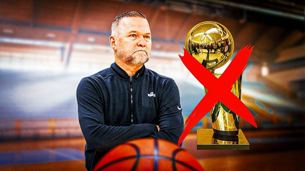 Nuggets coach Michael Malone looking upset towards an NBA Finals Championship trophy