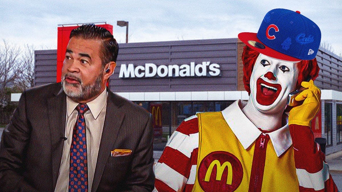Former Chicago White Sox manager Ozzie Guillen next to Ronald McDonald in a Cubs hat