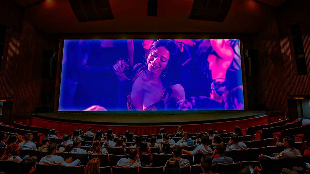 Anora photo inside a movie theater screen with audience