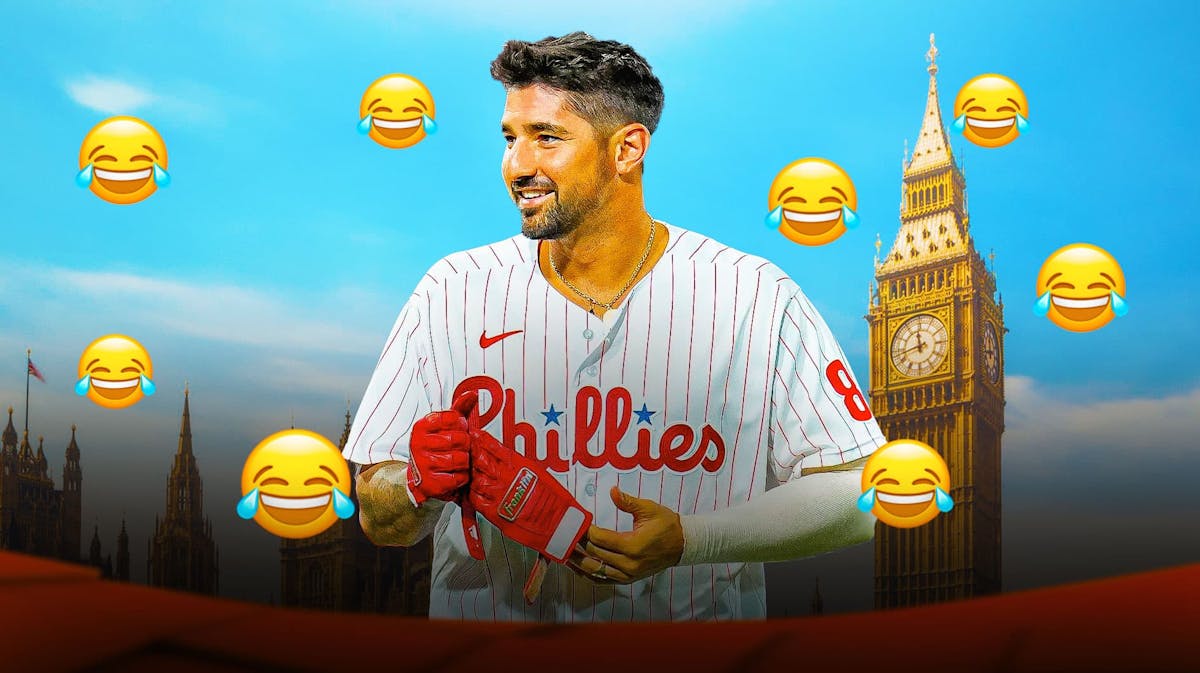 Photo: Nick Castellanos laughing in Phillies jerseys, laughing emojis all around him, Big Ben in London behind him