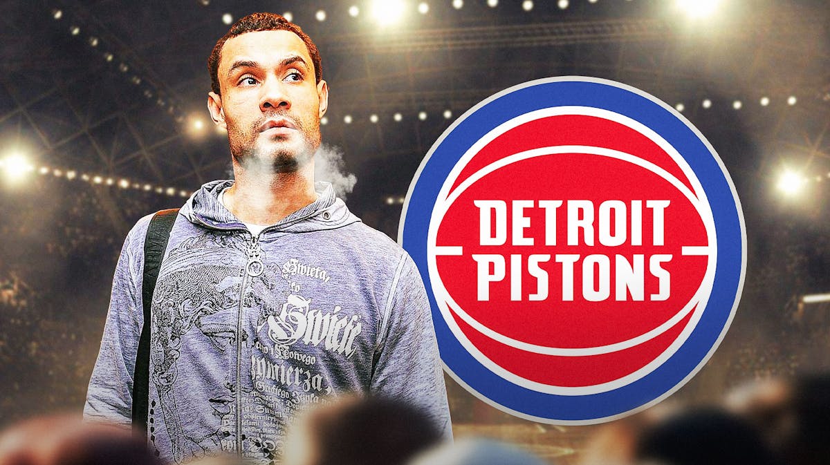 Trajan Langdon with smoke coming out his nose and ears. Pistons logo in the background
