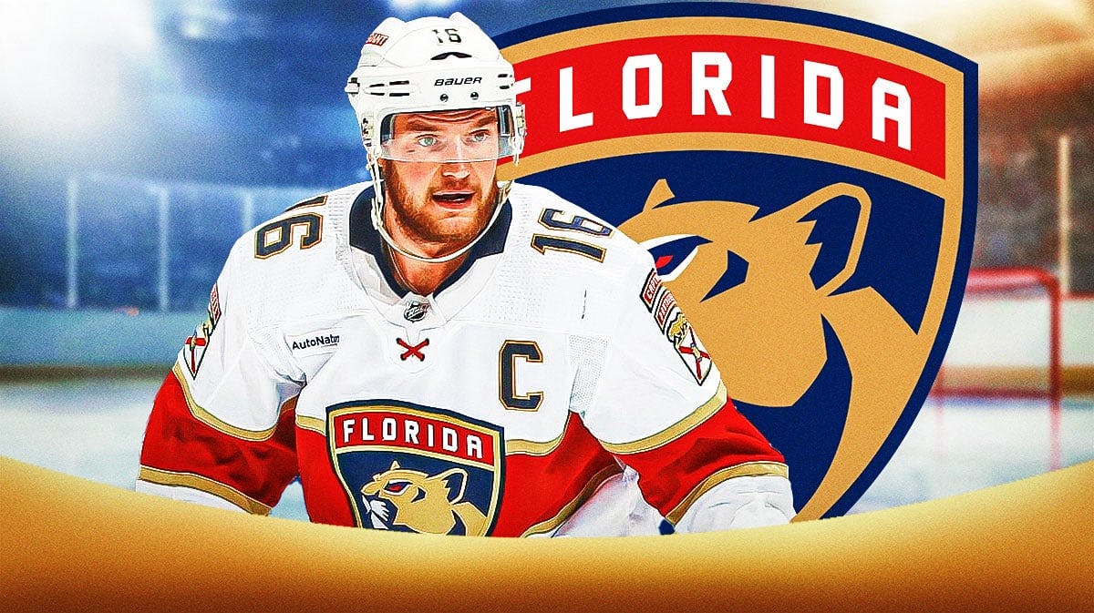 Sasha Barkov in middle of image looking stern, Florida Panthers logo, hockey rink in background