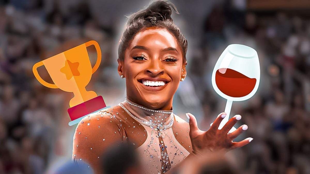 Gymnast Simone Biles, with a trophy emoji and wine glass emoji, to represent "aging like fine wine" and that she won the recent national championship
