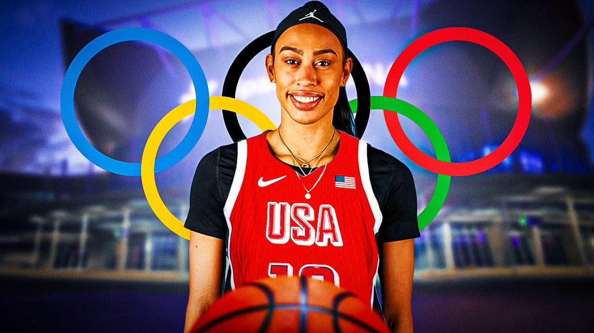 Dearica Hamby in a Team USA jersey with the Sparks arena and the Olympics logo in the background