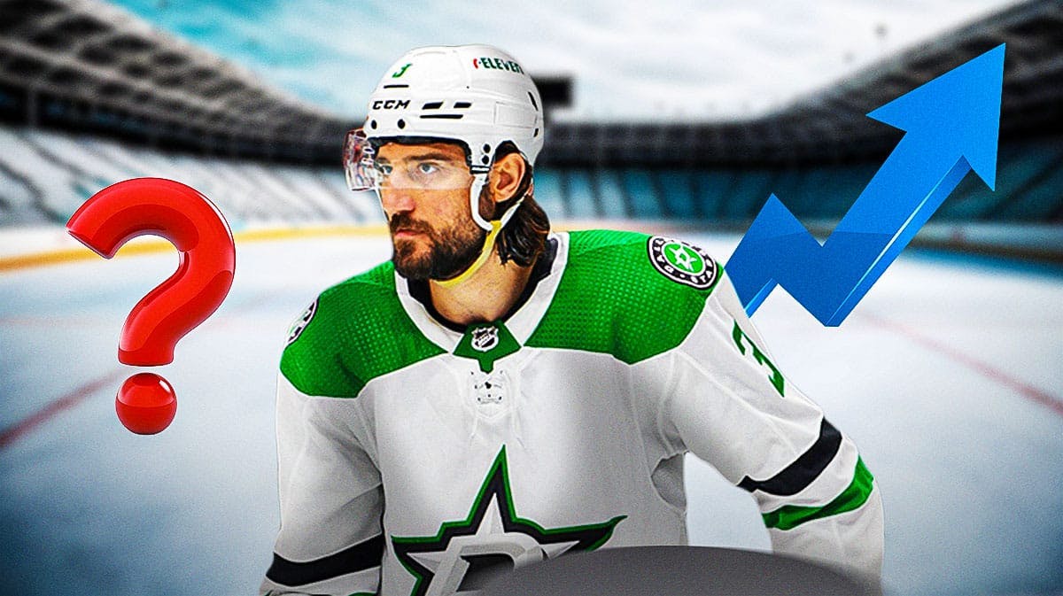 Stars player Chris Tanev with a stock up symbol.
