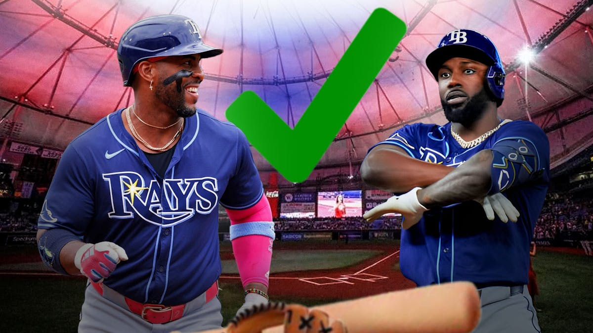 Randy Arozarena and Yandy Díaz in Tampa Bay Rays uniforms with a big green check mark either in between them.