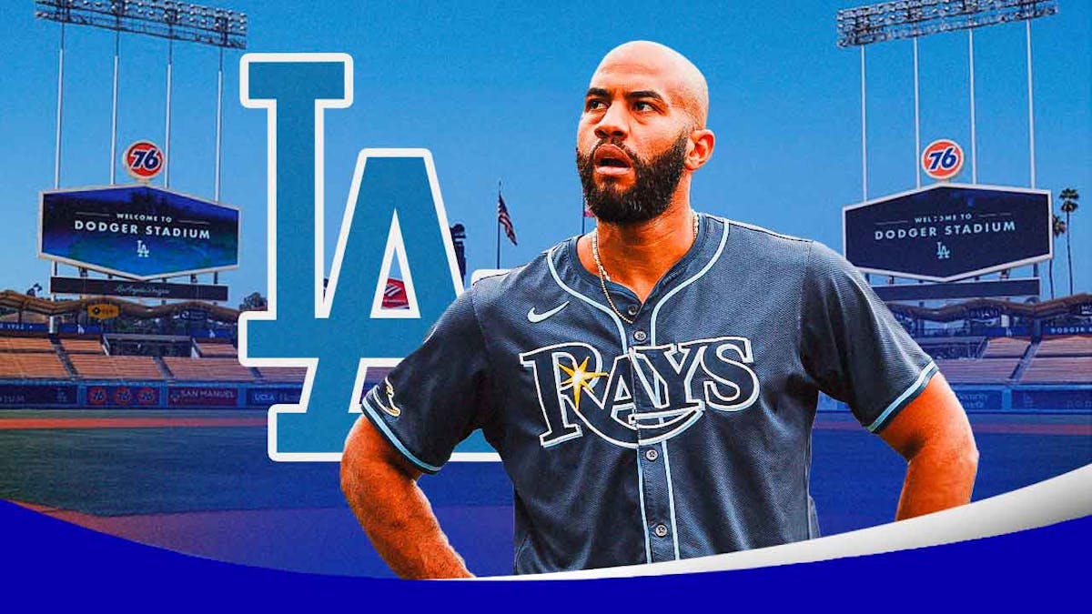 Rays' Ahmed Rosario stands next to Dodgers logo after trade